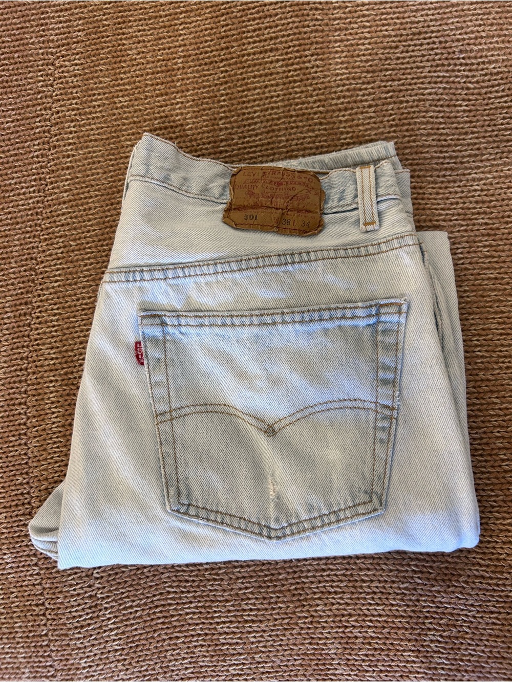 Vintage 1993 men's Levi's 501 light blue denim jeans with leather patch 38×34